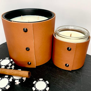 Large soy Man Candle with spiced honey, bourbon and smoke in a sexy caramel leather sleeve with 3 black studs