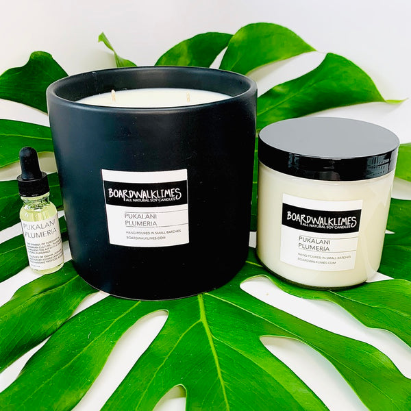 Large 3-wick 100% floral soy candle in plumeria fragrances in a handmade black ceramic jar, plumeria floral candle in a 1-wick soy candle in a glass jar with a modern lid, cold air diffuser oil in a floral plumeria scent