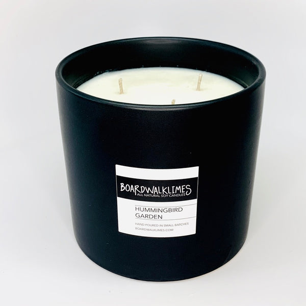 3-wick high end soy candle in a handmade matte black 5" ceramic vase