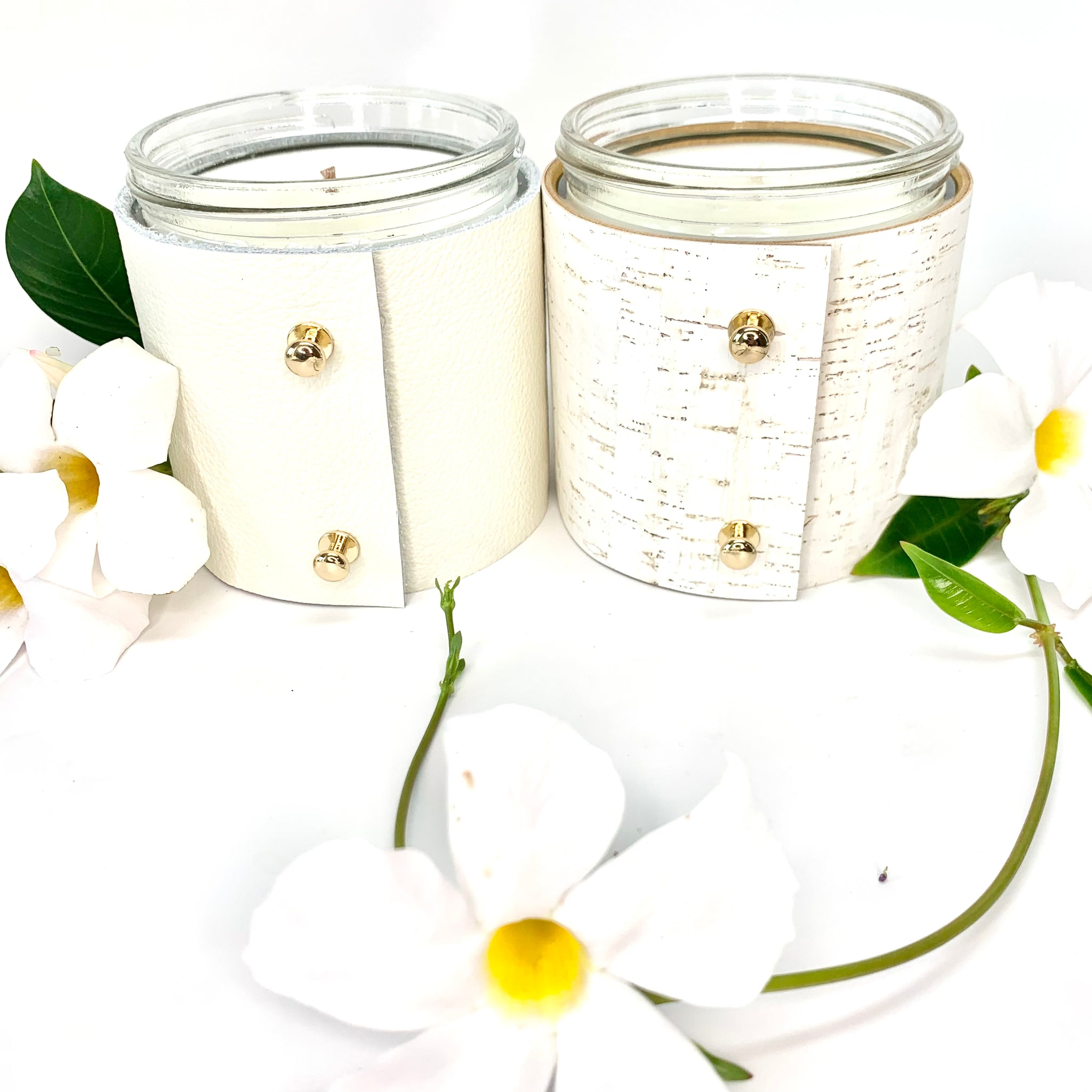 2 Luxury floral soy candles in topical plumeria and beautiful rose and gardenia scented candles wrapped in fine white leather and white cork with gold button studs
