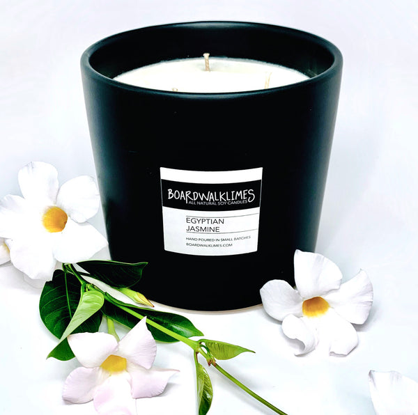 3-wick high end soy candle in a handmade matte black 5" ceramic vase filled with jasmine floral fragrances and citrus fragrances