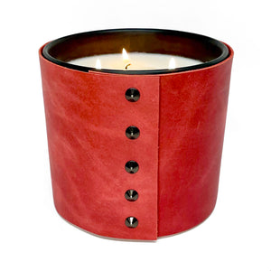 Red leather wraps around a 3-wick large all natural soy candle 