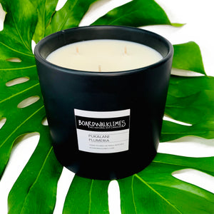 3-wick large luxury soy candle in an handmade matte black ceramic vase scented in Hawaiian flowers and tropical fragrances