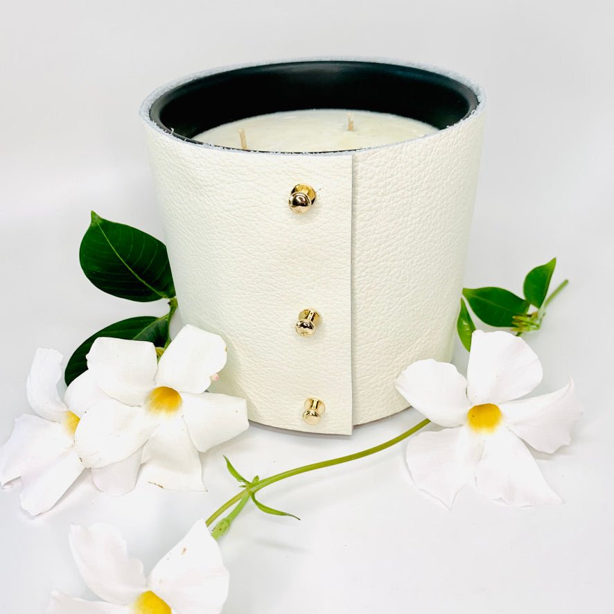 Large Luxury 3-wick Soy Candle in exotic floral and jasmine fragrances in a designer fine white leather wrap with 3 rose gold colored studs
