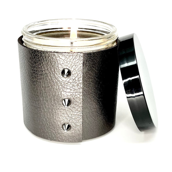 Luxury all natural soy candle in a metallic leather in gunmetal grey with 3 shiny silver cone shaped studs