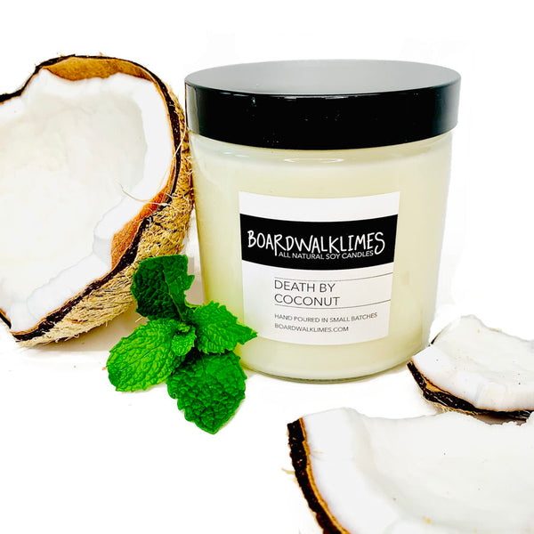 Smooth coconut with a hint of mint soy candle in a glass jar with a shiny black lid