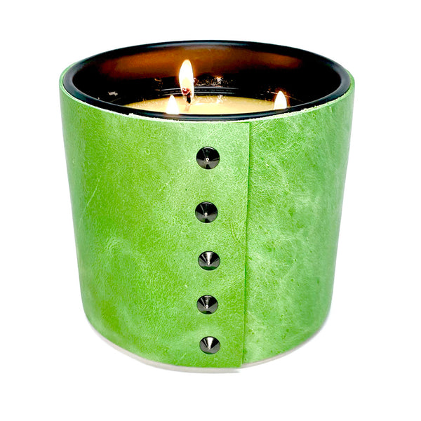 large all natural soy candle with 3 wicks is wrapped in a spring green leather with 5 black cone shaped studs