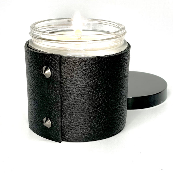 This is a luxury all natural soy candle wrapped in a rick black textured leather with 2 black cone shaped studs