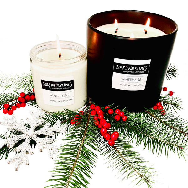 The best winter scented all natural soy candle is rich with pine and tart berries in a clear glass jar