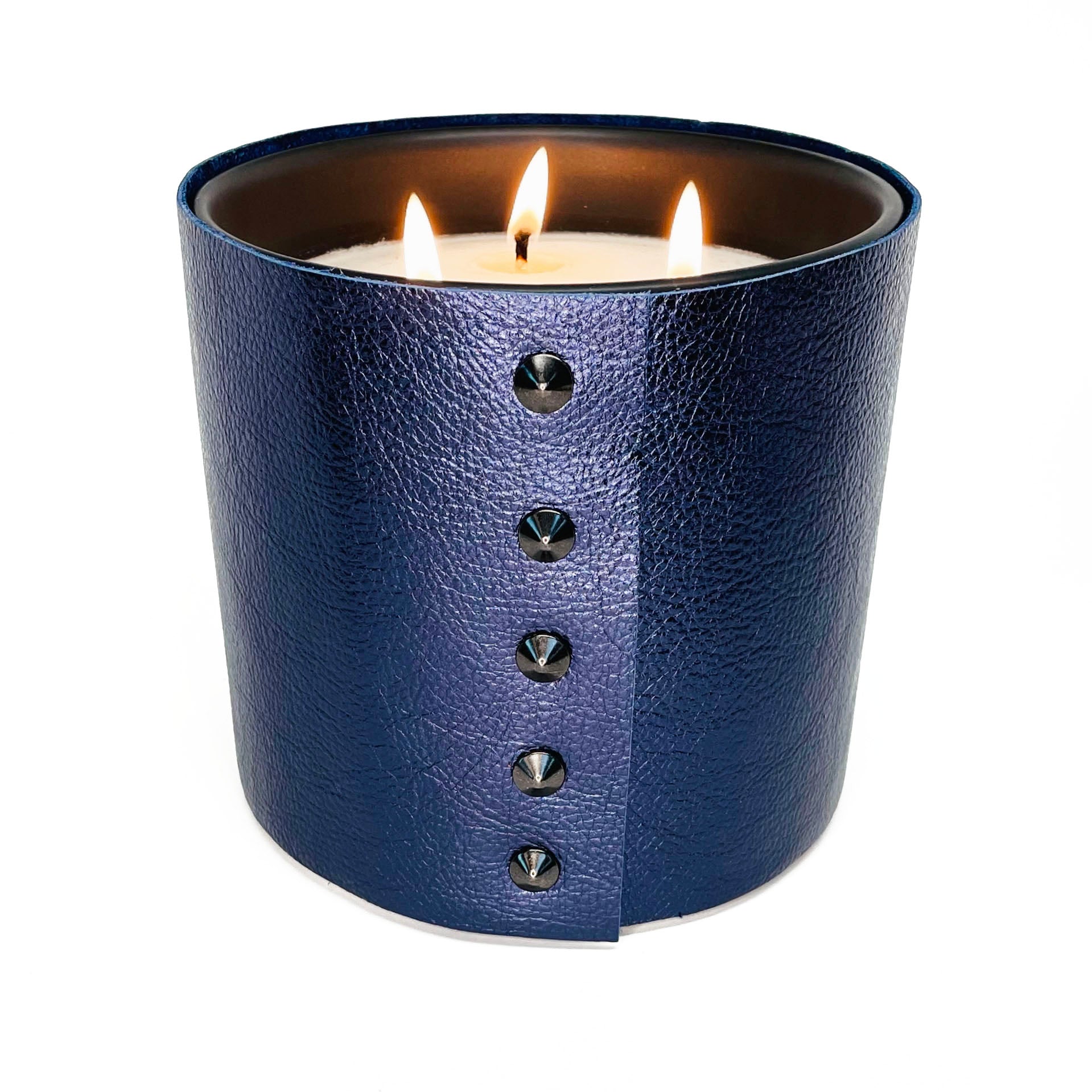 large 3-wick luxury soy candle in metallic sapphire leather with oil rubbed black studs