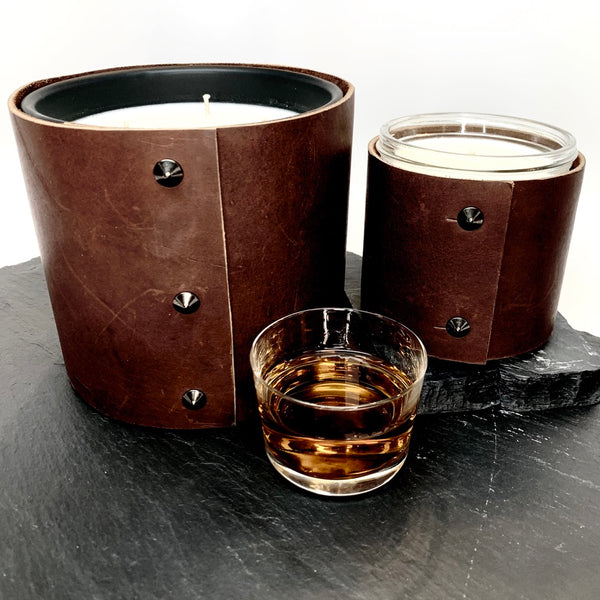 Luxury 3-wick soy candle scented in a fine whiskey and leather wrapped in rugged Teton leather with oil rubbed black studs, 1-wick soy candle in modern glass jar wrapped in rugged dark brown leather