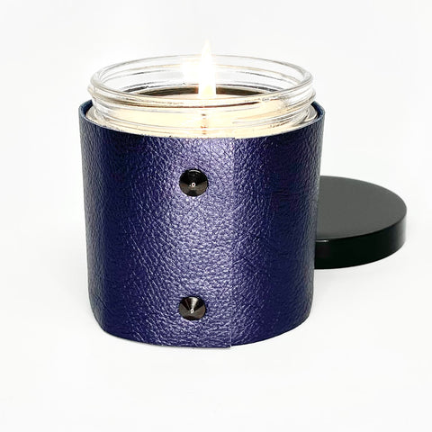 Luxury Soy Candle in a designer metallic sapphire leather sleeve with 2 black studs