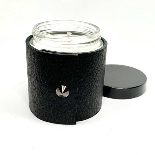 4 oz soy candle with textured black fine leather sleeve and oil rubbed black stud