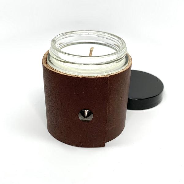 4 oz luxury soy candle with dark brown Teton leather sleeve with oil rubbed black stud